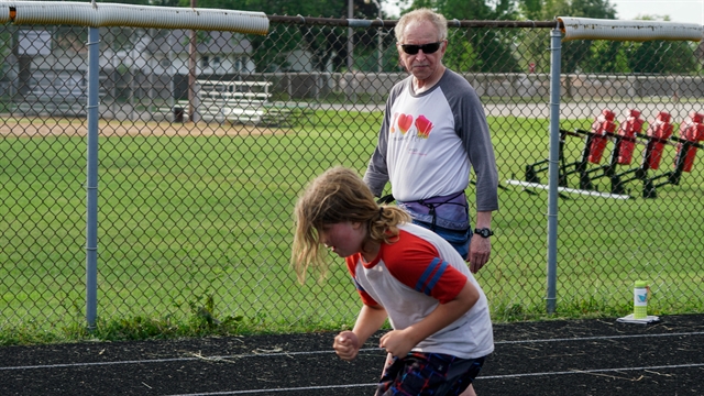 Marty Malin instructs a participant in "Running Speedwork" class